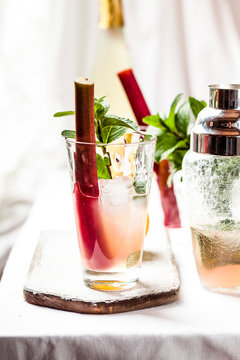 Rhubarb Collins with gin, prosecco, lemon juice, rhubarb juice and hibiscus syrup