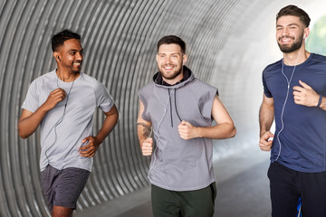 fitness, sport and healthy lifestyle concept - smiling young men or male friends with earphones...
