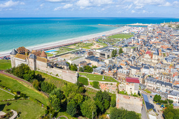 Aerial view of Dieppe town, the fishing port on the English Channel, at the mouth of Arques river. On a clifftop overlooking pebbly Dieppe Beach is the centuries-old Chateau de Dieppe, now the museum - obrazy, fototapety, plakaty