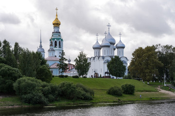 Fototapeta na wymiar View from Vologda river on Belfry, Church of Alexander Nevsky and Saint Sophia Cathedral, Vologda, Russia