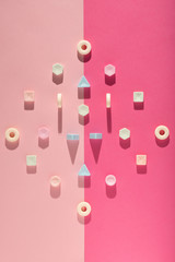 Candies on a light pink background