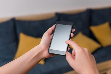 woman using smartphone office supplies technological devices inside home