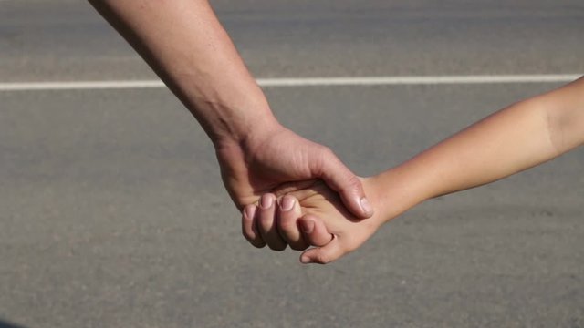 Man And Child Join Hands To Form A&nbsp;Human Chain. Peaceful Political Demonstration.
