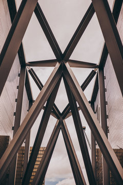 Steel beams intersecting each other on a bridge.