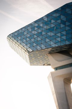 The edge of a blue triangle mosaic building.