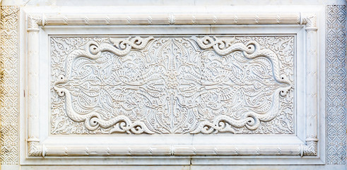 Floral pattern. Oriental style marble carving used in the outer part of the mausoleum of Mohammed V in Rabat Morocco, Africa
