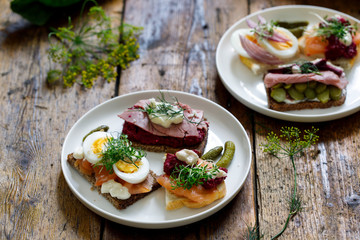 Selection of Scandinavian open sandwiches with beef, beetroot and egg