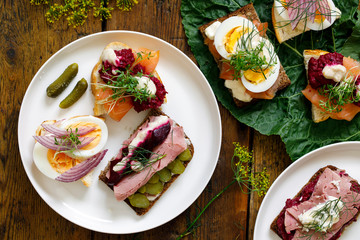 Selection of Scandinavian open sandwiches with beef, beetroot and egg
