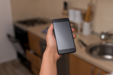 woman using smartphone office supplies technological devices inside home