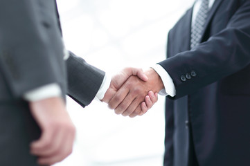 Close up image of business handshake at meeting.