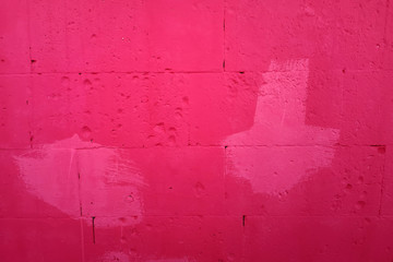 Red concrete wall background with white blurred spots. Beautiful texture. Text insertionConcrete wall background with red