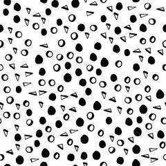Seamless vector pattern. Simple shapes background. Many hand drawn isolated triangles, circles, rings, dots, brushstrokes. Geometric pattern for clothes, prints, fabric, invitations, cards.