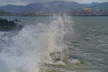 Atlantic ocean, town on the shore of Biscay Bay in summer day in Basque country near Bilbao city. Natural background, suitable for banner, postcard, greeting card, poster. High resolution photography.