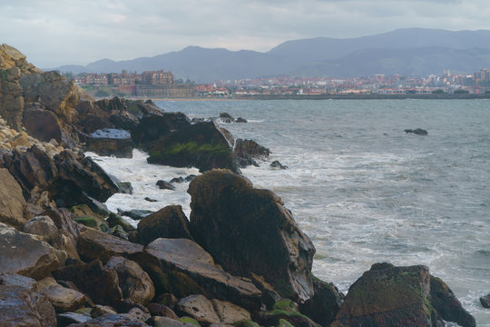 Atlantic ocean, town on the shore of Biscay Bay in summer day in Basque country near Bilbao city. Natural background, suitable for banner, postcard, greeting card, poster. High resolution photography.