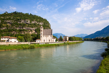 Fototapeta na wymiar Trento (Italy) - Sant'Apollinare romanic church in Trento, along the river Adige, northern Italy