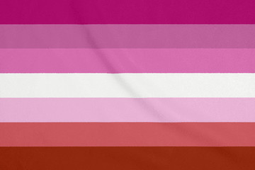 LGBT lesbian community flag on a textured fabric. Pride symbol