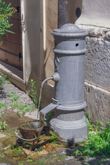 Fototapeta na wymiar The hydraulic pump with clean fresh drinking water in Rome