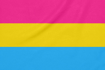 LGBT pansexual community flag on a textured fabric. Pride symbol