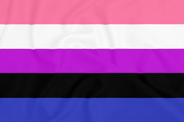 LGBT genderfluid pride community flag on a textured fabric. Pride symbol