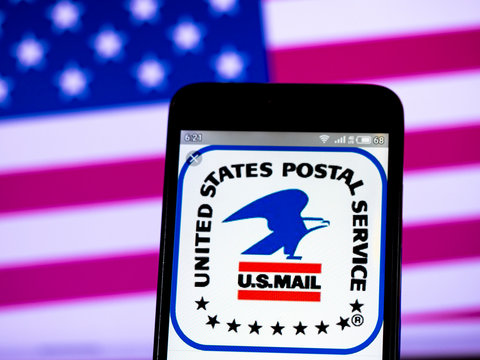 In this photo illustration the United States Postal Service logo is seen displayed on a smartphone, Kiev, Ukraine, Aug 1, 21019