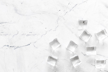 Pile of ice cubes on marble bar desk background top view mockup