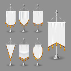 Set of white various flags with golden fringe. Empty pennants of various shapes isolated on gray background. Realistic vector illustration