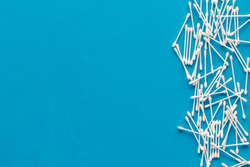 Hygiene cotton swabs for pattern on blue background top view mockup