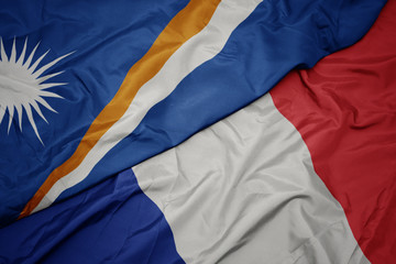 waving colorful flag of france and national flag of Marshall Islands ,.