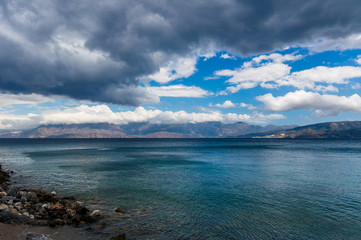 Heavy clouds over Agios Nikolaos bay, Crete, Greece