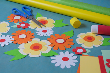 Flowers cut from color paper and card