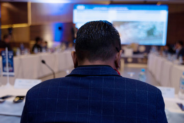 Businessman at business conference room with public giving presentations. Audience at the conference hall. Entrepreneurship club.