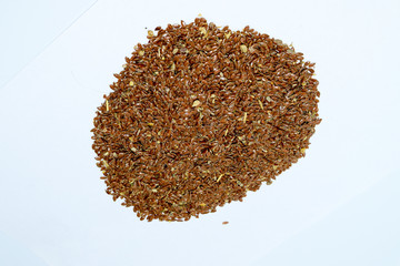Flax seeds. Storage of flax seeds. Flax, essential oil culture. A handful of flax seeds.
