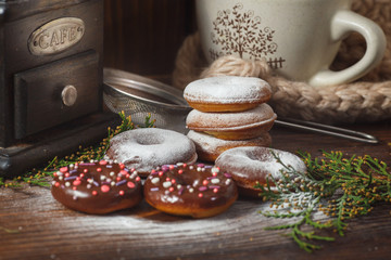Homemade donuts with candy cane for the Christmas, New Year or any winter celebration on the vintage wooden background