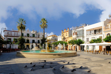SANLUCAR OF BARRAMEDA, SPAIN-september 2018 - Town library building with a clock tower in the Plaza...