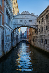 Fototapeta na wymiar Bridge of Sighs. Traditional narrow canal in Venice, Italy. Summer