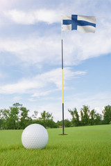 Obraz premium Finland flag on golf course putting green with a ball near the hole