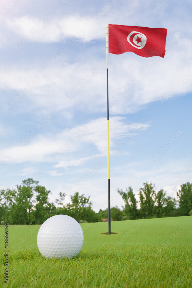 Wall mural Tunisia flag on golf course putting green with a ball near the hole