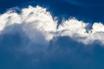 Naklejka na ściany i meble Heavy clouds with clear blue sky before storm