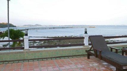 Panning shot of View at the the sea shore and sunbeds from a beach