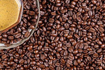 Brown coffee beans a cup of coffee placed on a ready to drink coffee