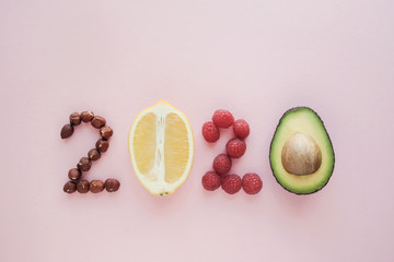 2020 made from healthy food on pastel pink  background, Healhty New year resolution diet and lifestyle