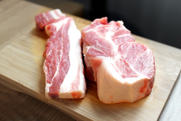 Two pieces of Raw Pork. Different types of raw pork meat on wooden. top view