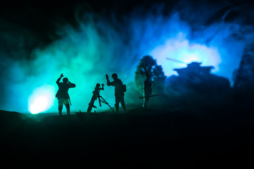 Fototapeta na wymiar War Concept. Military silhouettes fighting scene on war fog sky background,