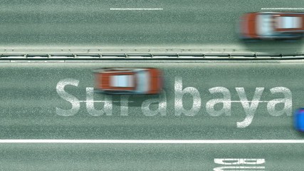 Top down view of the highway with revealing Surabaya text. Driving in Indonesia intro clip