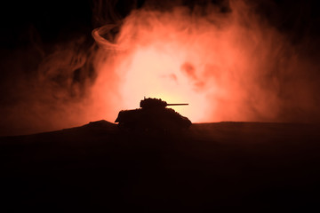 War Concept. Military silhouettes fighting scene on war fog sky background, Silhouette of armored...