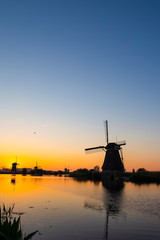 Beautiful Romantic Dutch Windmills in Front of The River in Kinderdijk Village in the Netherlands. Picture Taken At Golden Hour.