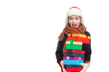 Smiling Caucasian Girl With Heap of Gift Boxes Posing in Winter Outfit Against Pure White in Studio.