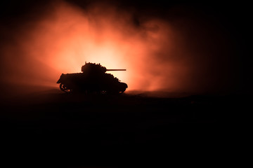 War Concept. Military silhouettes fighting scene on war fog sky background, Silhouette of armored...
