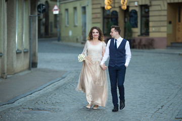 Naklejka premium Happy Just Married Couple Having a Stroll Outdoors