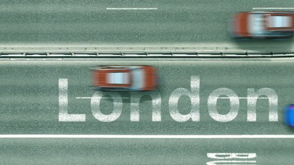 Top down view of the highway with revealing London text. Driving to the United Kingdom intro clip